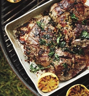 GREEK-STYLE BUTTERFLIED AUSSIE LEG OF LAMB WITH ROASTED VEGETABLES AND GRILLED LEMON