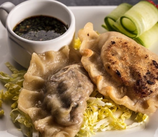 Steamed lamb dumplings with orange blossom ponzu