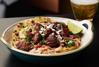 Lamb tacos with salsa verde and avocado