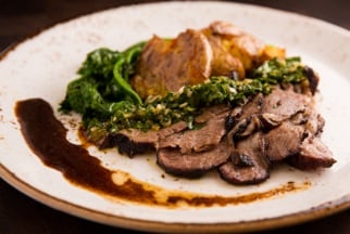 Slow roasted Australian lamb with roasted potatoes, rapini & gremolata